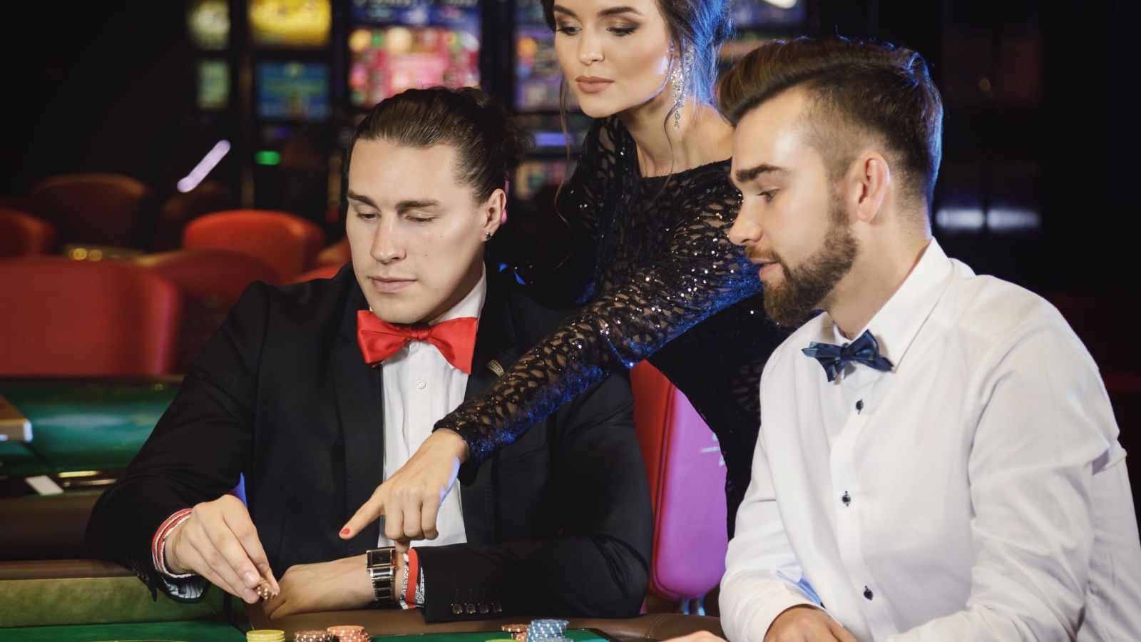 Group of young rich people playing roulette in the casino